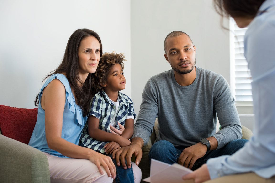 family-talking-to-family-counselor Family talking to family counselor
