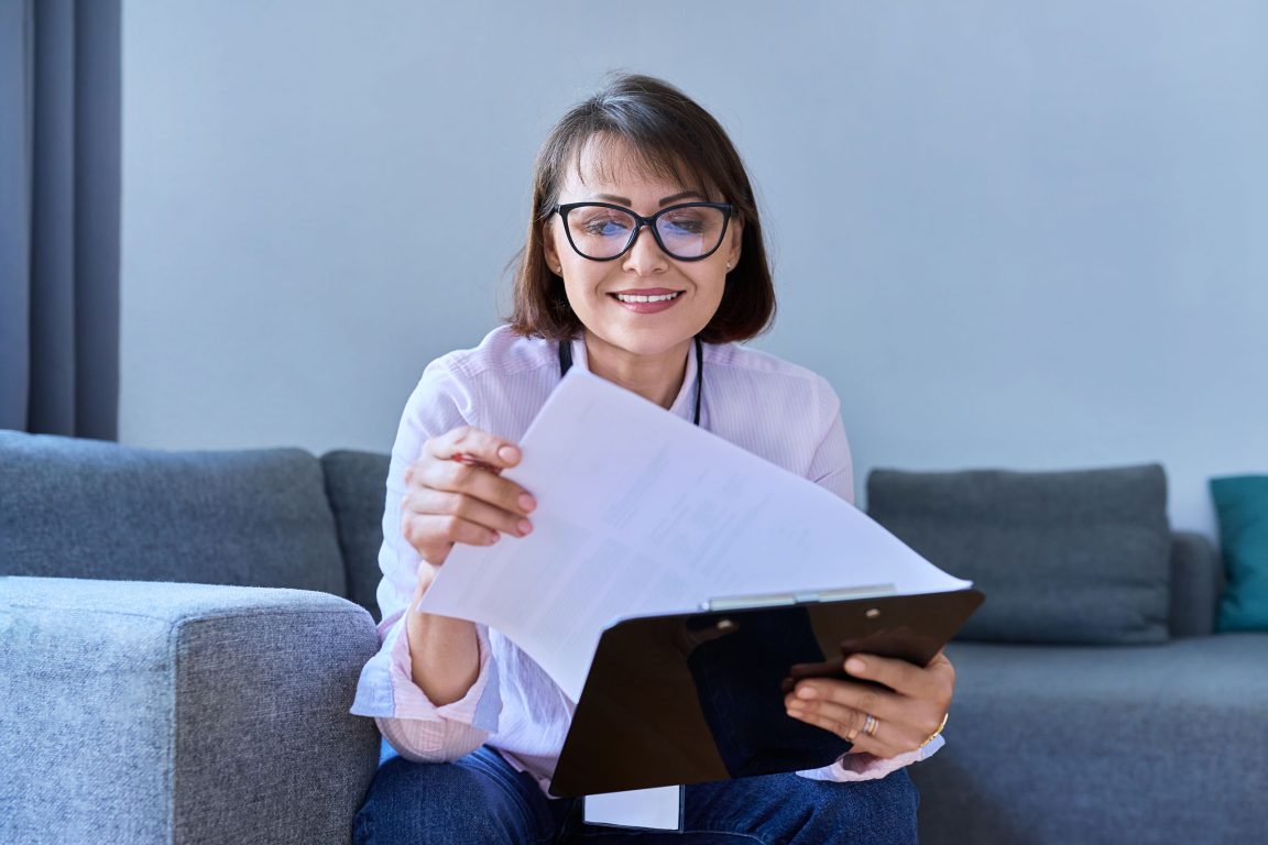 Female psychologist with clipboard working